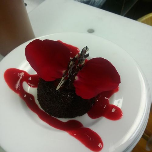 Chocolate lava cake with a raspberry syrup