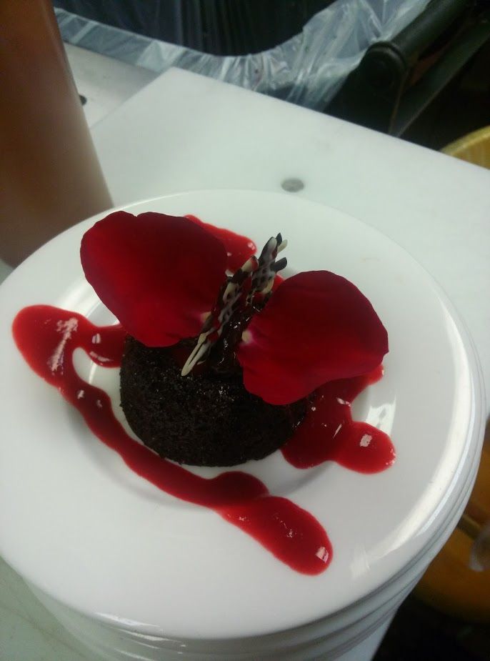 Chocolate lava cake with a raspberry syrup
