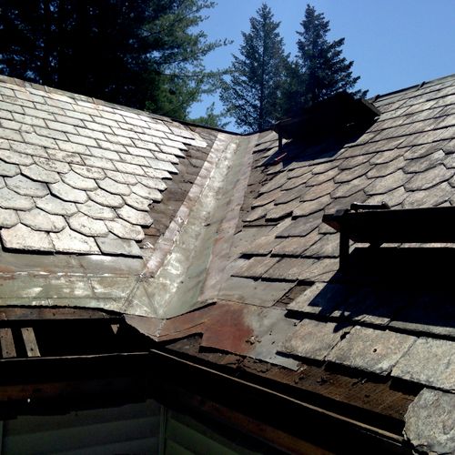 Replacing a worn out tin valley on a slate roof, B