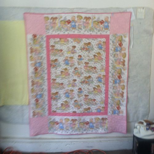 Pink Cabbage Patch Kid themed quilt.