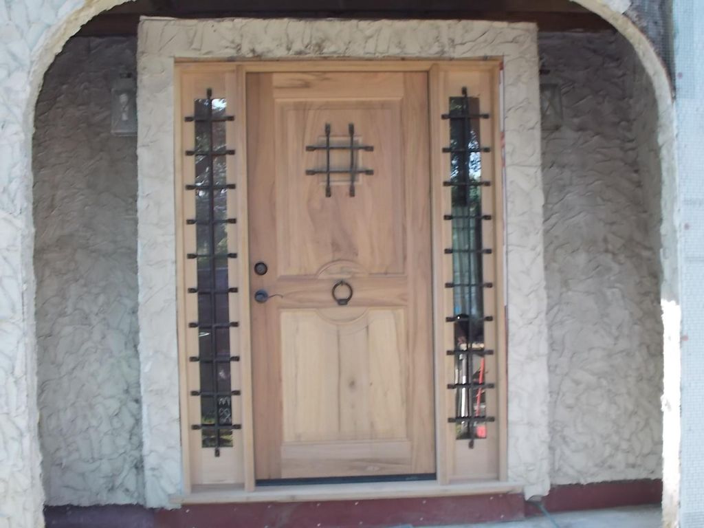 New oversized front door installed. Stucco repair 