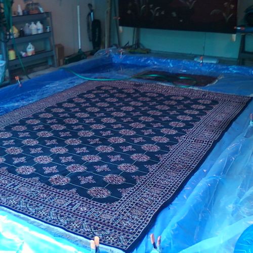 a urine contaminated oriental rug being restored i