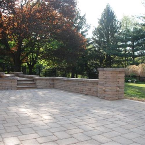 Paver patio in 6x9 and chapel stone wall.