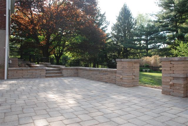 Paver patio in 6x9 and chapel stone wall.