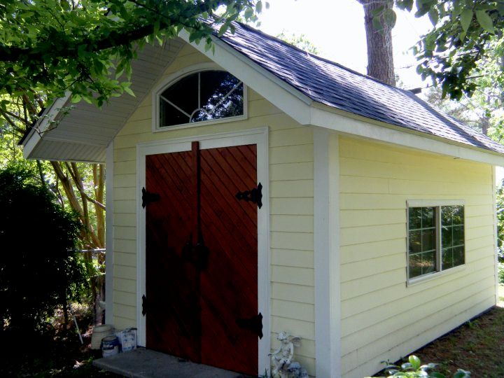 Shed I built back home. Custom doors.