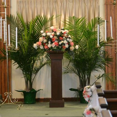 Large Altar piece and pew flowers with custom dyed