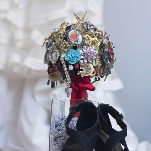 Her bouquet was made from brooches.