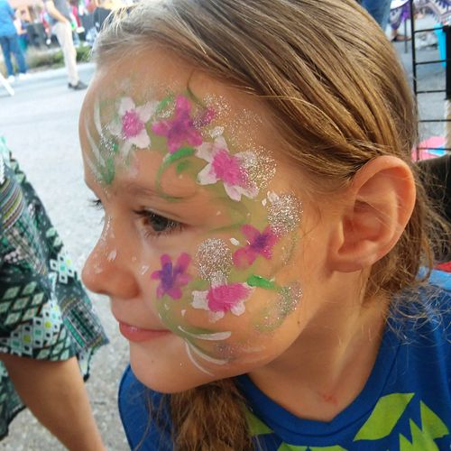 Kids face painted at Benson First Friday