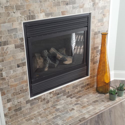 A fireplace we installed with tile