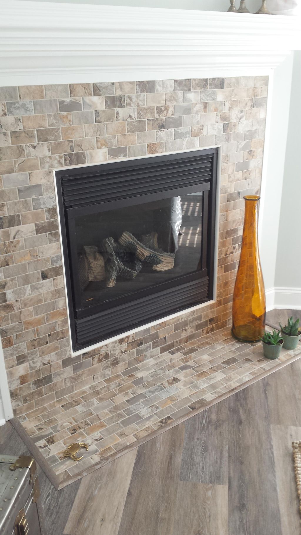 A fireplace we installed with tile