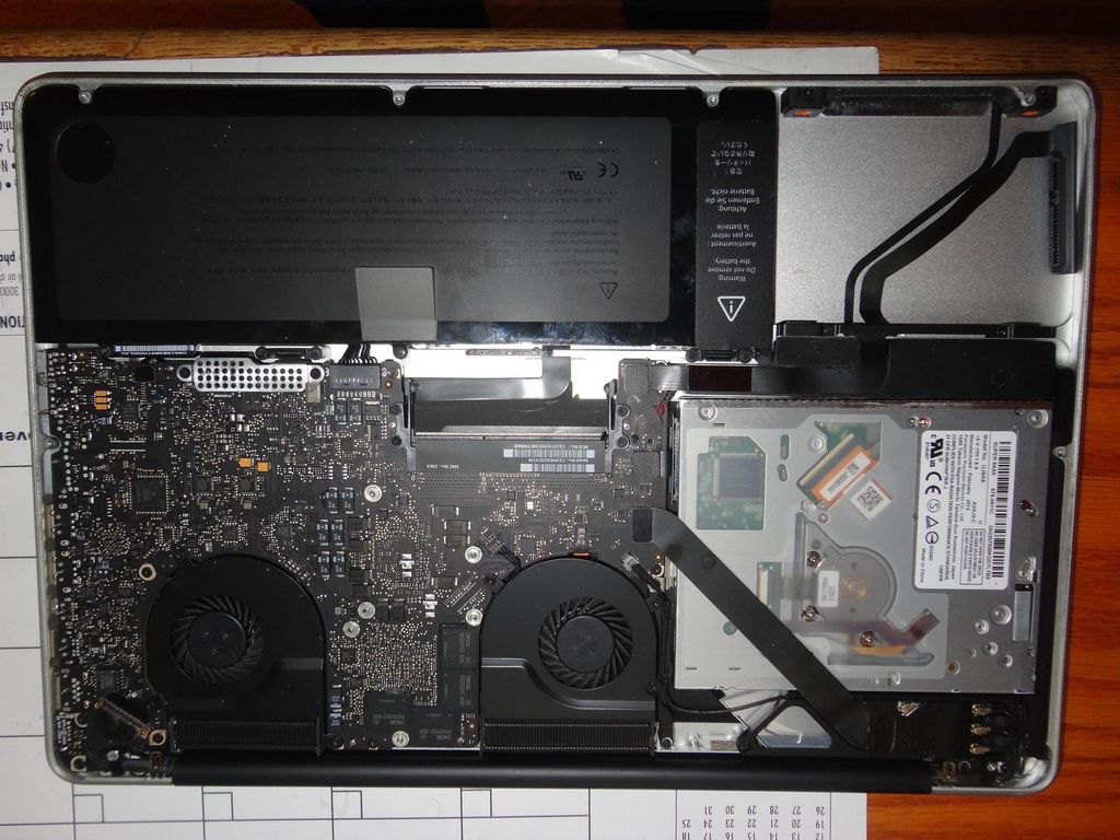 MacBook Pro in the middle of a repair job for a ha