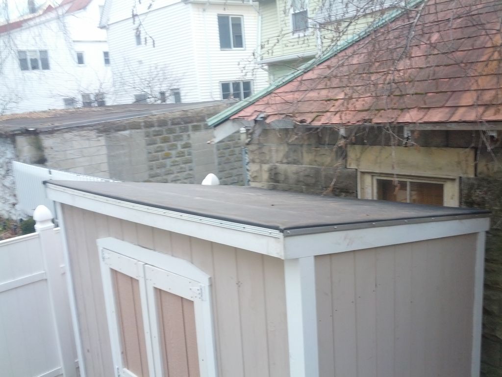 new rubber roof installed on shed