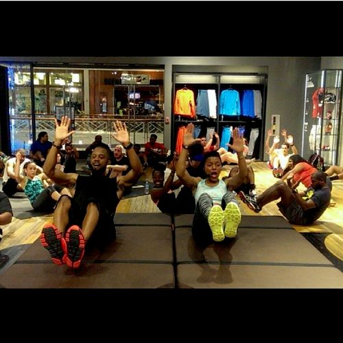 Leading a group fitness class with fellow Nike tra