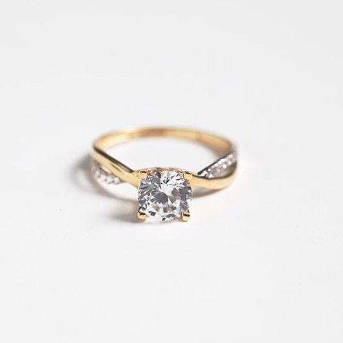 Diamond Solitaire Ring w/ accent diamonds on braid