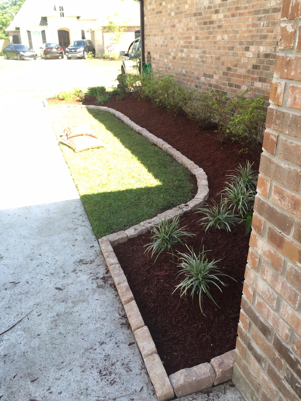 Created a new flowerbed and lined it with beautifu