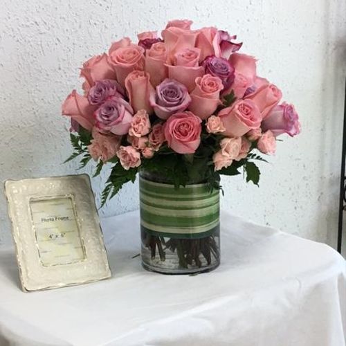 This arrangement is created using 4 dozen Pink "Es