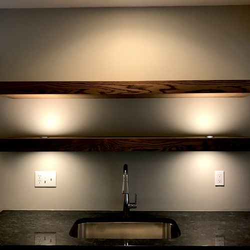 Puck lights installed above and below a custom mad