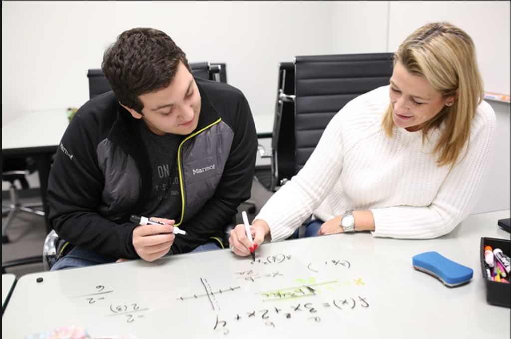 Our tutor Jennifer working closely with a student 