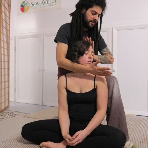 Neck stretching in the seated position