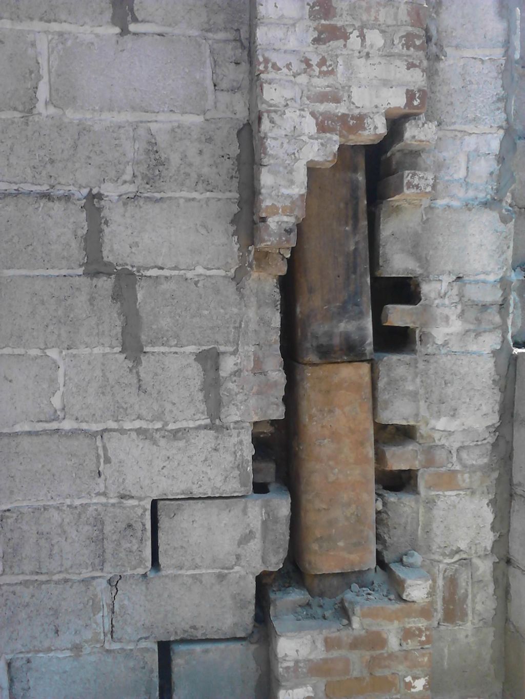 shifting foundation cracked across  chimney, rebui