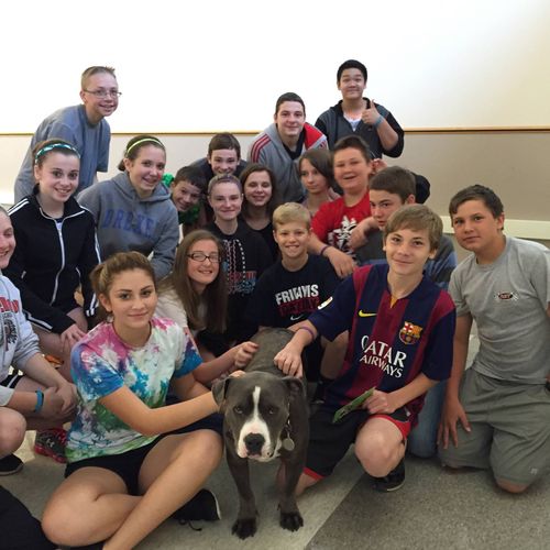 Grady, my therapy dog, with the kids at the middle