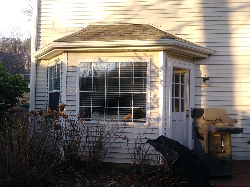  This house had old aluminum siding and windows. R