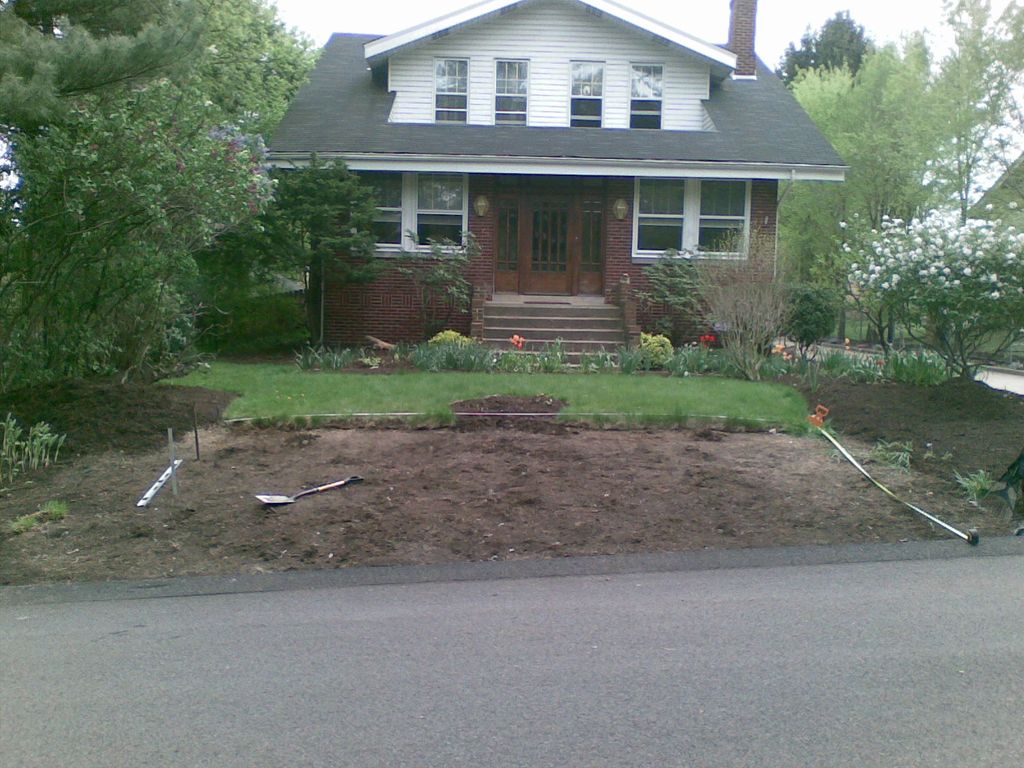 Treated wood planter and low maintenance gravel in