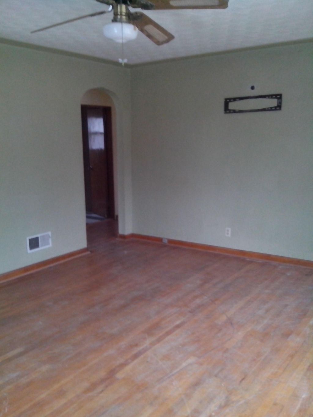 The before state of a hard wood floor reconditioni