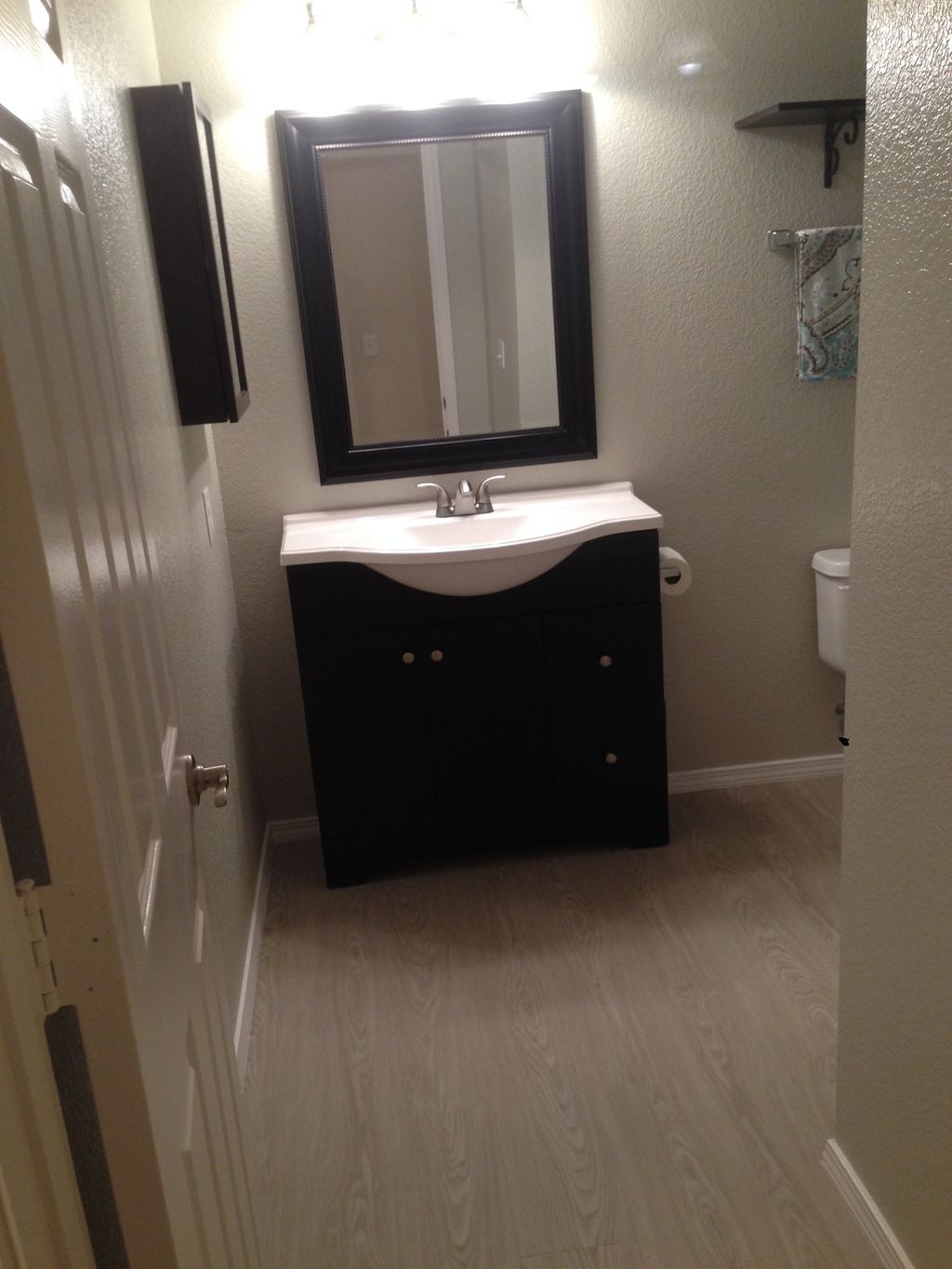 remodeled guest bath. new vanity/ flooring /and pa
