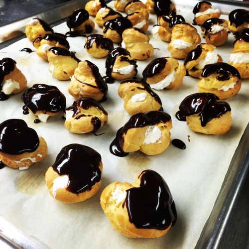 Mini Chocolate Choux Buns filled with chantily.