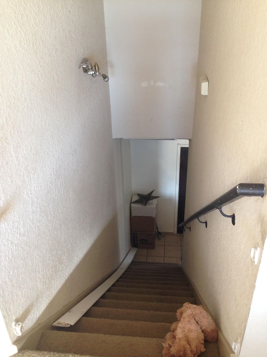 Carpeted stairs before engineered wood laminate