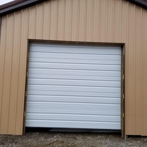 Commercial ribbed garage door installed before con