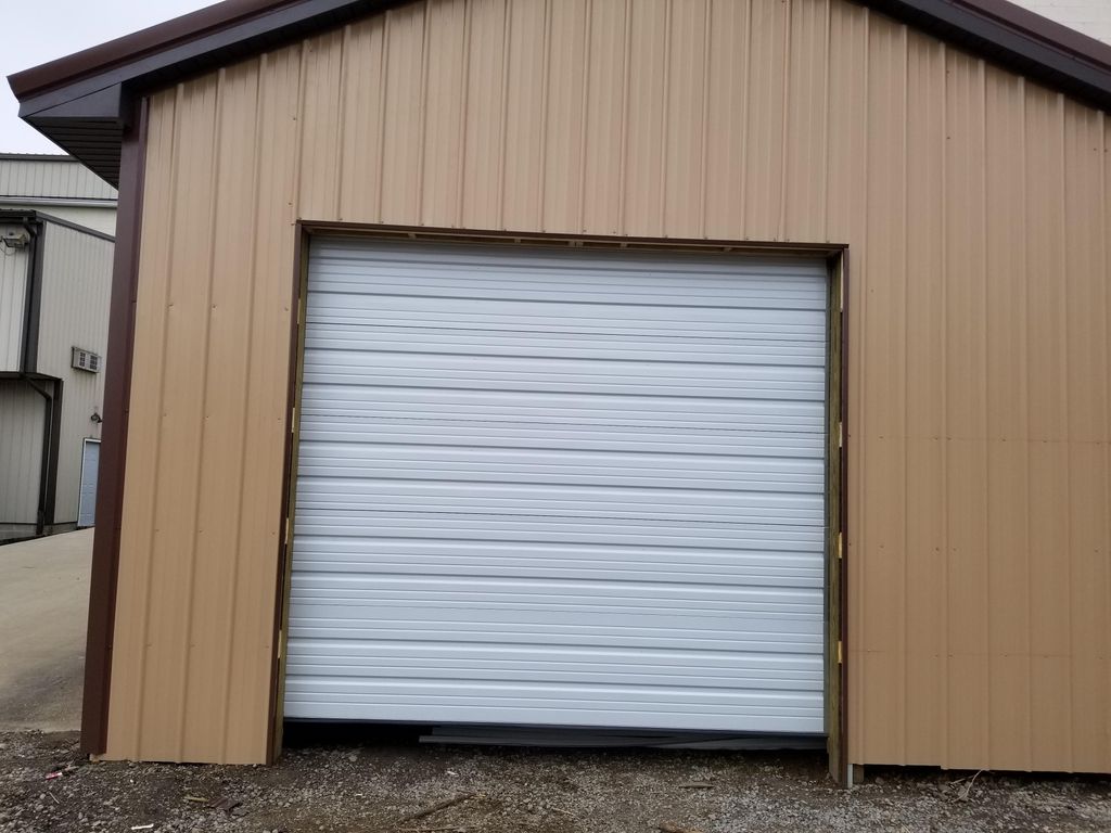 Commercial ribbed garage door installed before con