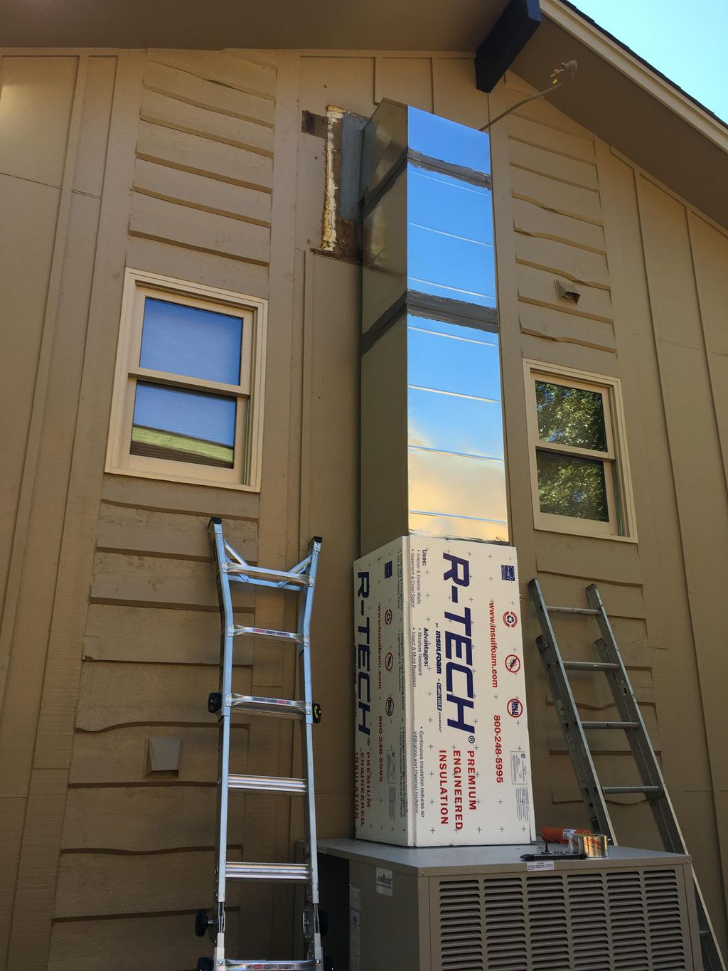 Upflow swamp cooler with duct to attic. A chase wi