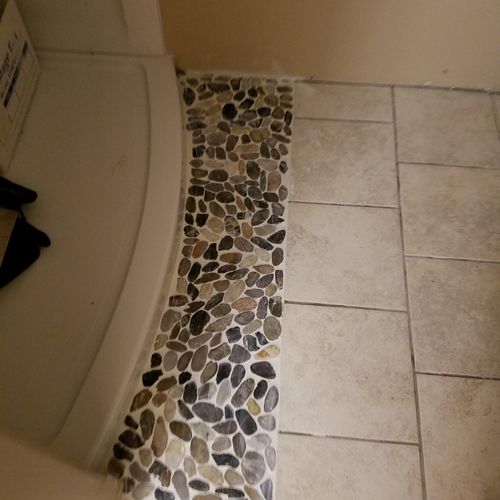 polished stone accent shower
