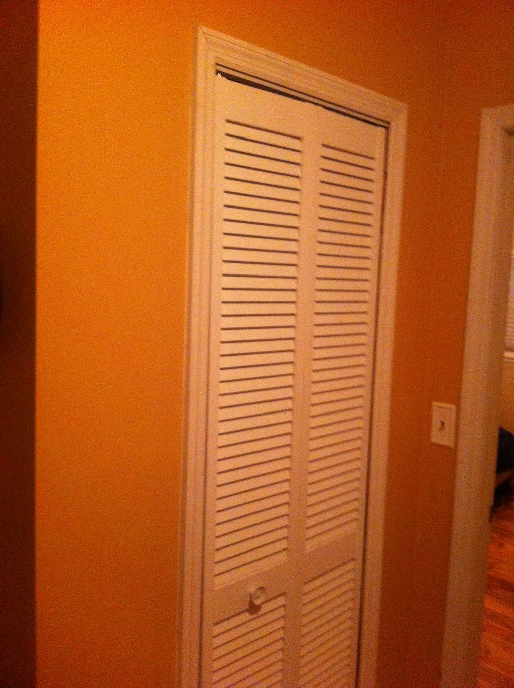 Louvered door and trim installed during house upda