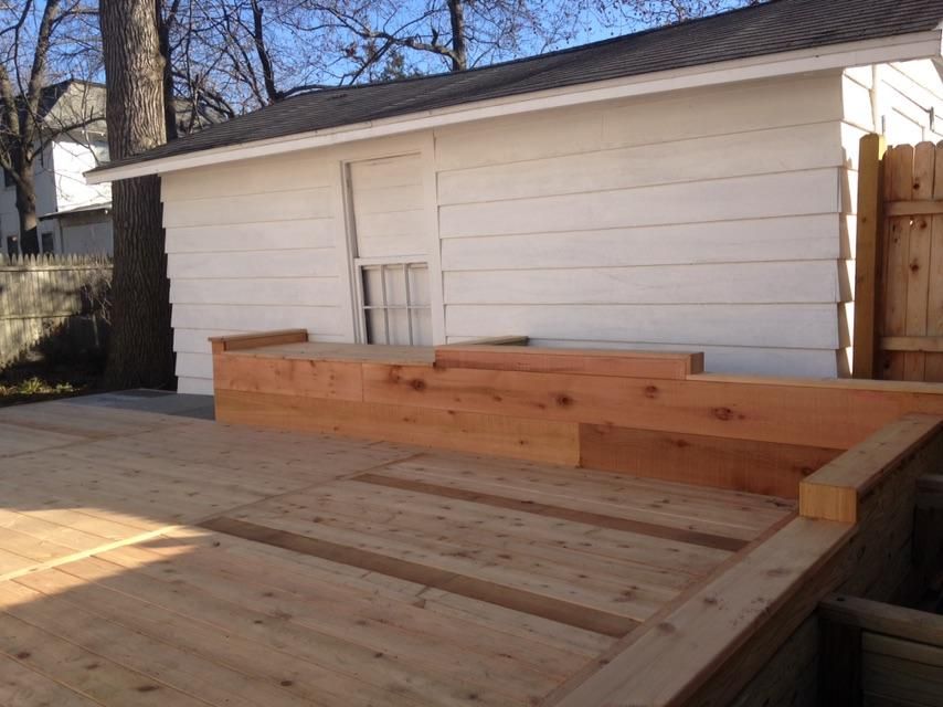 Cedar decking in Asbury Park with planting beds an