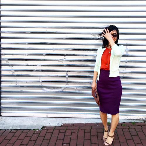 Rosana, wearing a custom CEO skirt in plum.