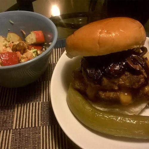 Cheddar stuffed Burger topped mushrooms and grille
