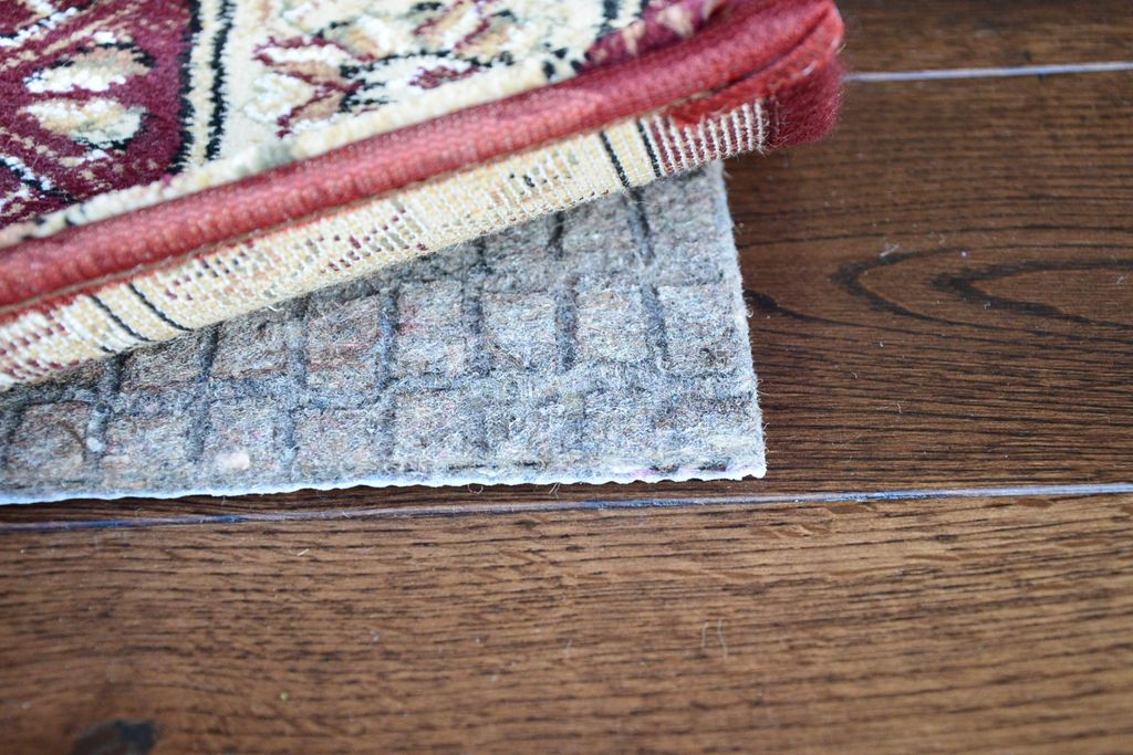 The use of a dense felt rug pad under your newly c