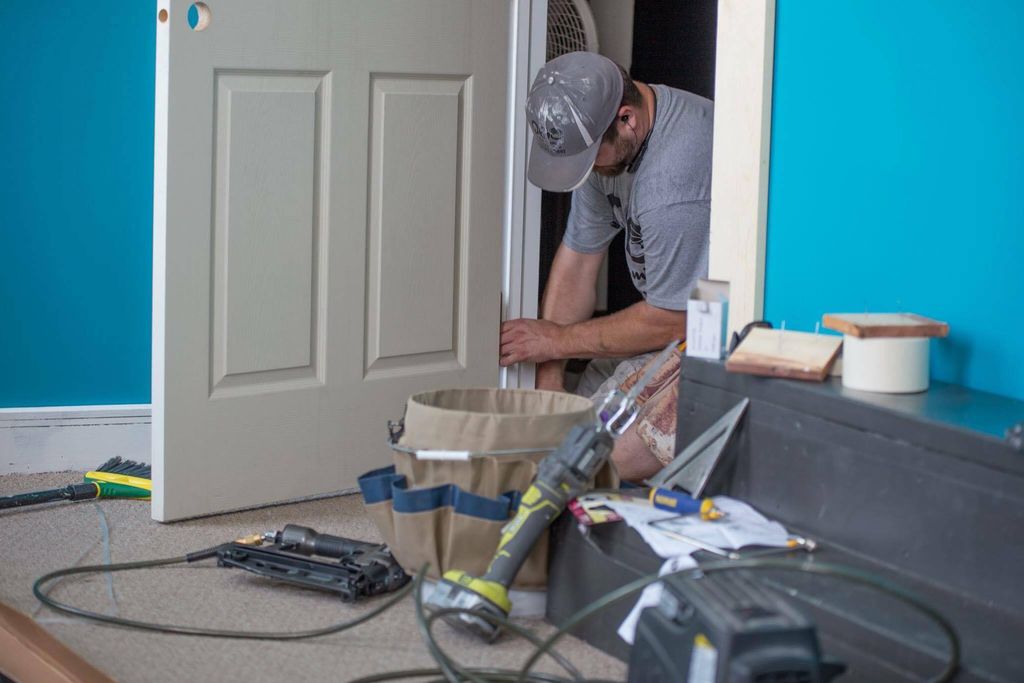 Hard at work installing a new door.