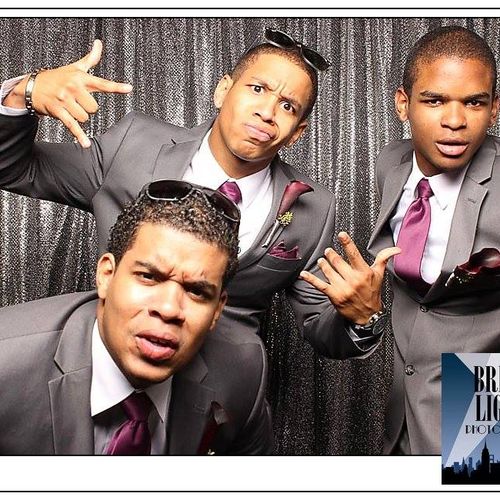 The groomsmen taking over the photo booth!