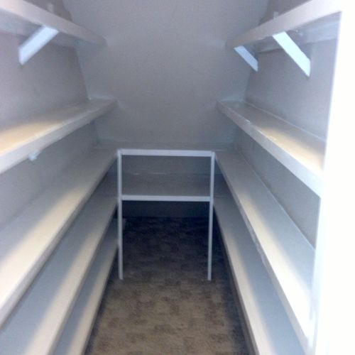 Pantry built in under stairway closet.