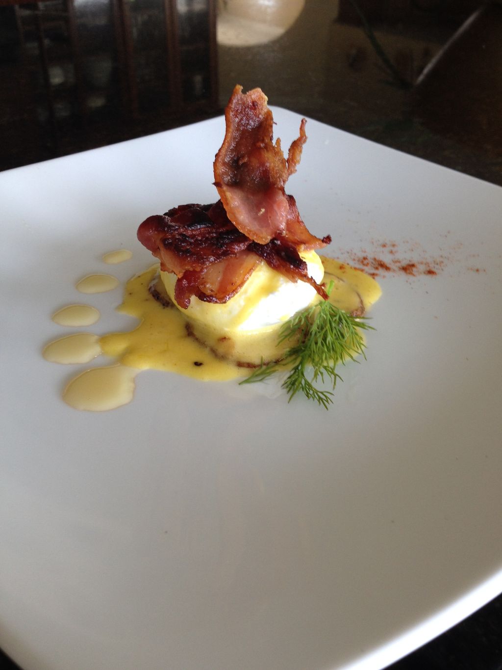 potato gaufrette topped with poached egg and holla