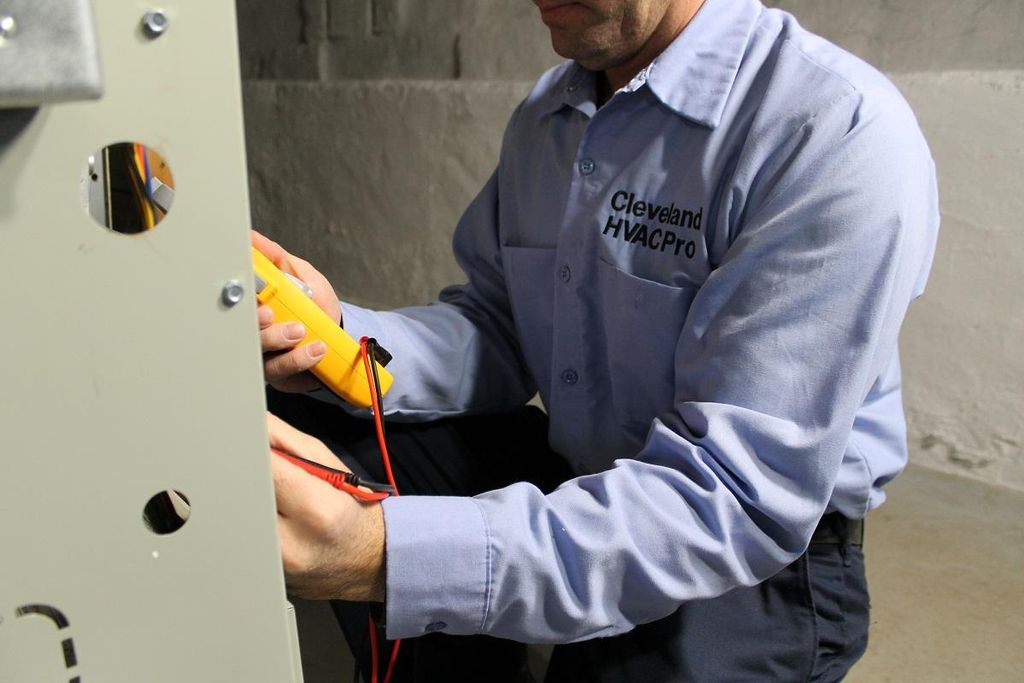 Technician working on a gas furnace.
