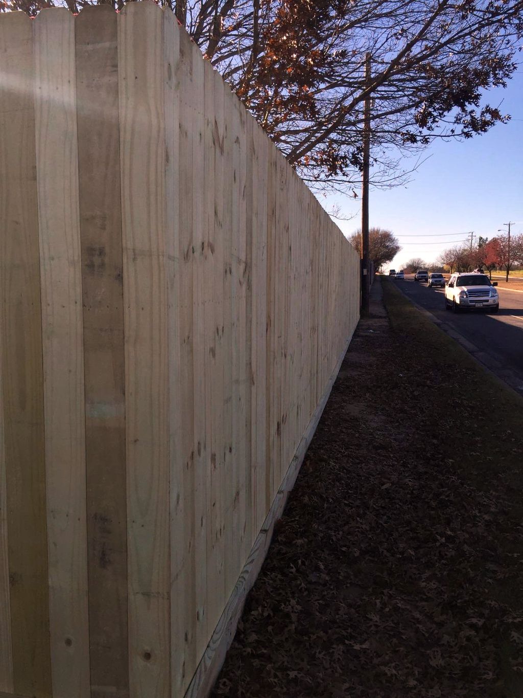 8' wood privacy fence with rot board in Bedford.