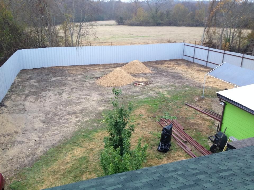 Brush Clearing, dirt work and new metal fence.