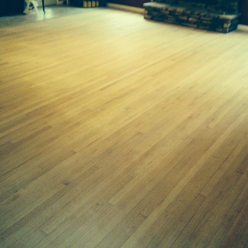 Refinishing oak harwood floors throughout home.