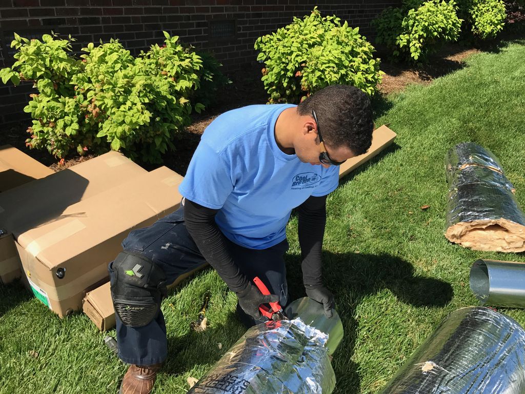 Felix cutting new Duct work for a House in High Po