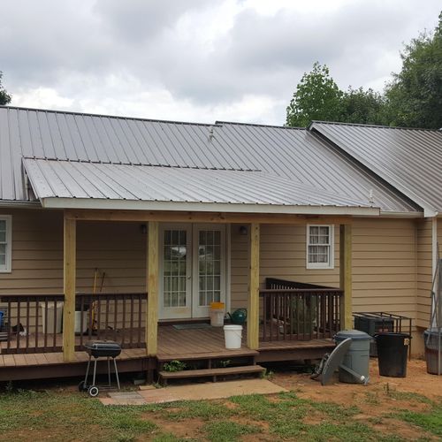 We added the porch roof and installed a metal roof